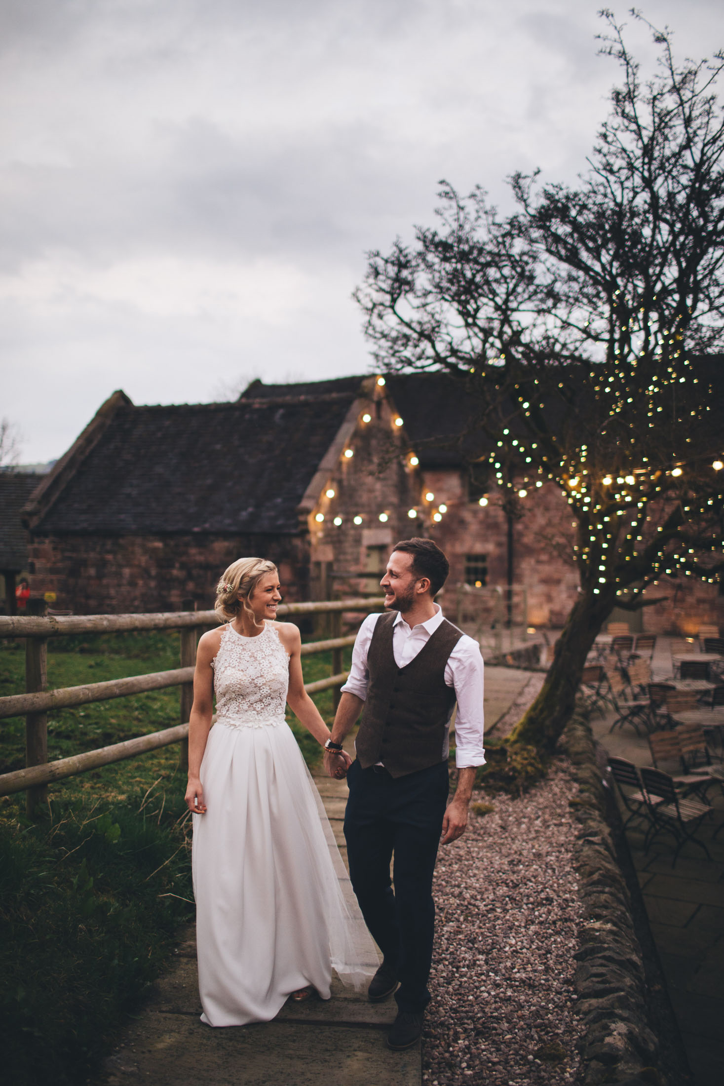 gorgeous portrait of couple in front of fairy lights