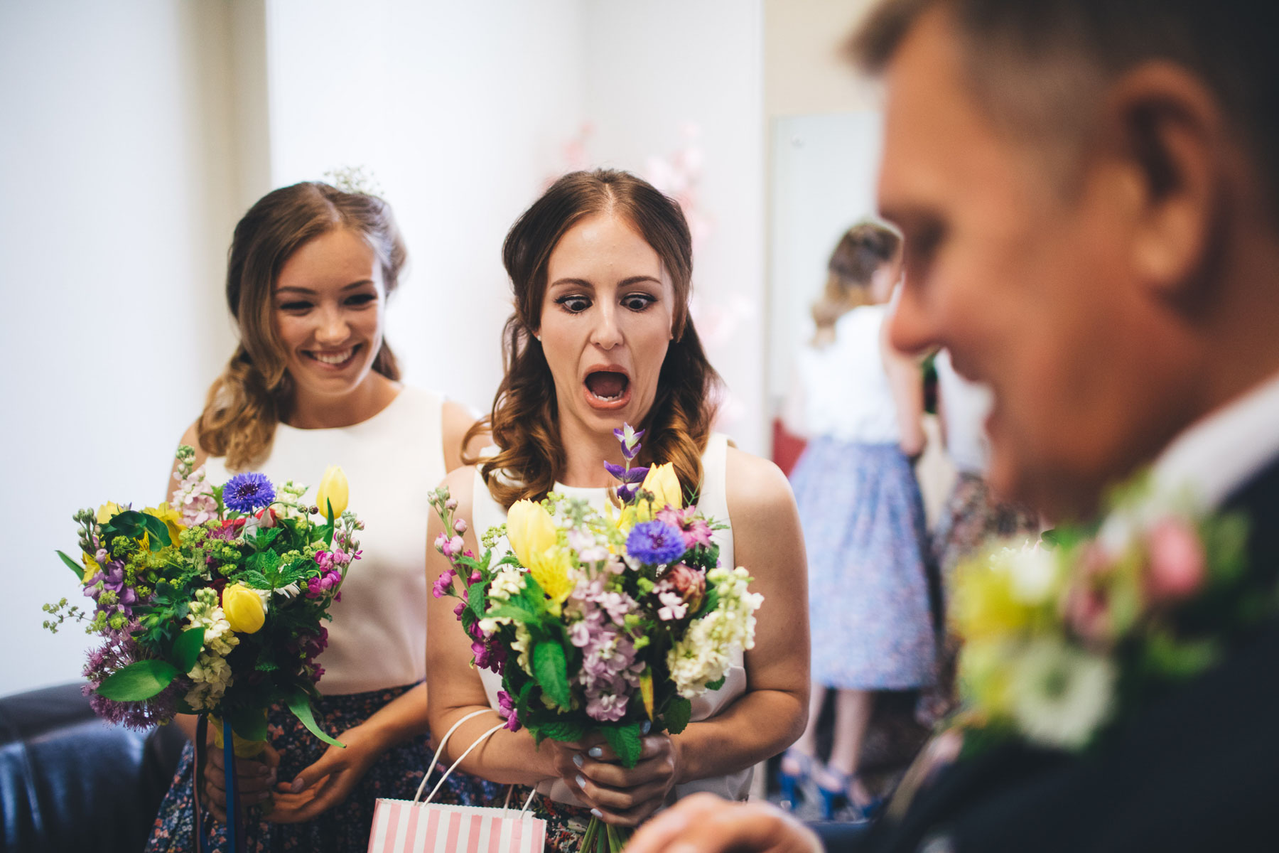 bridemaids gives funny expression at bouquet