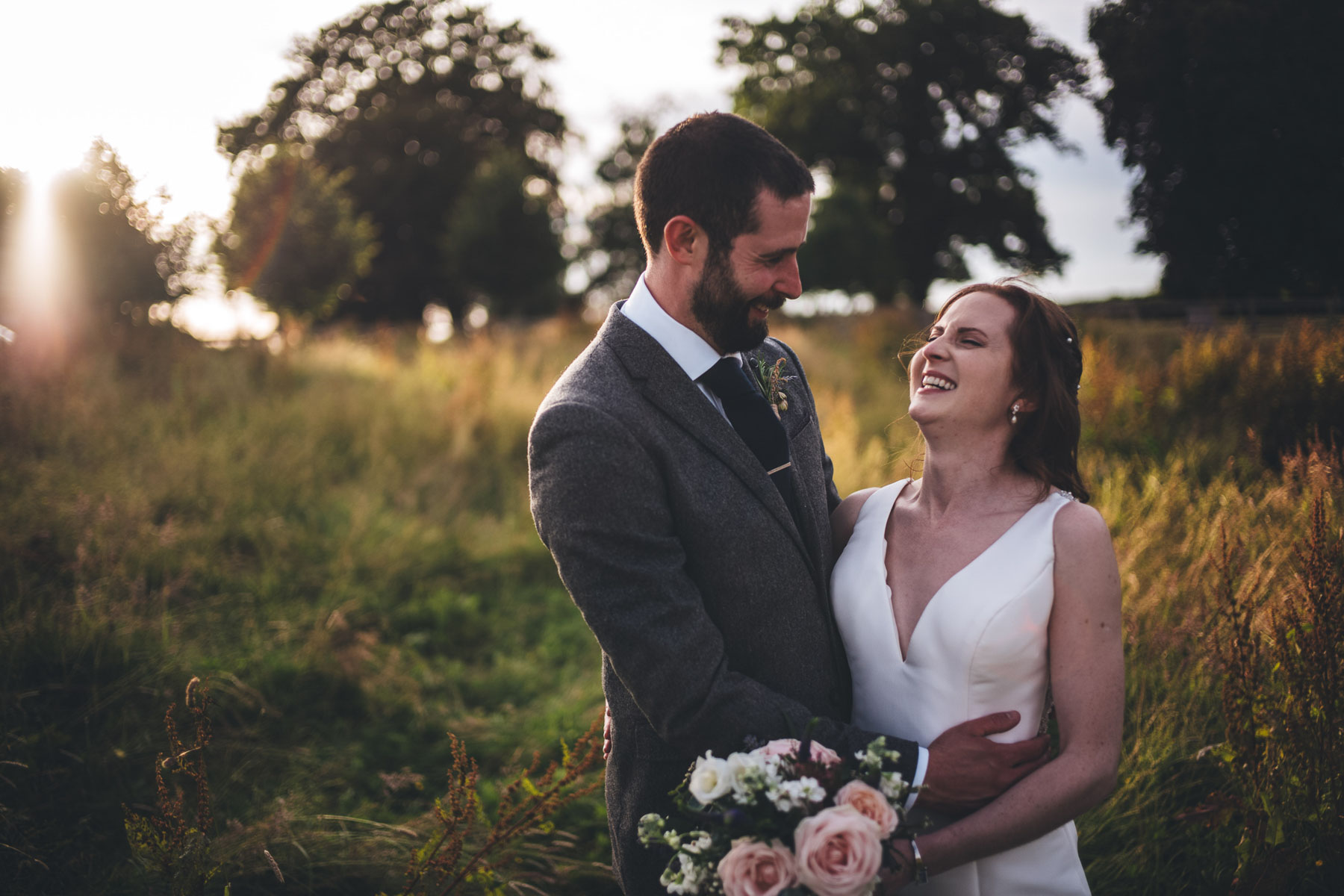 couple laugh in beautiful light