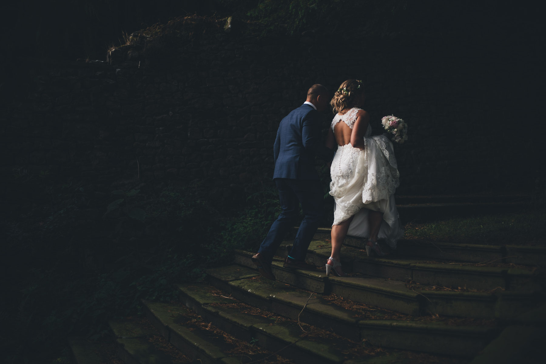 couple walk up steps in fading evening light