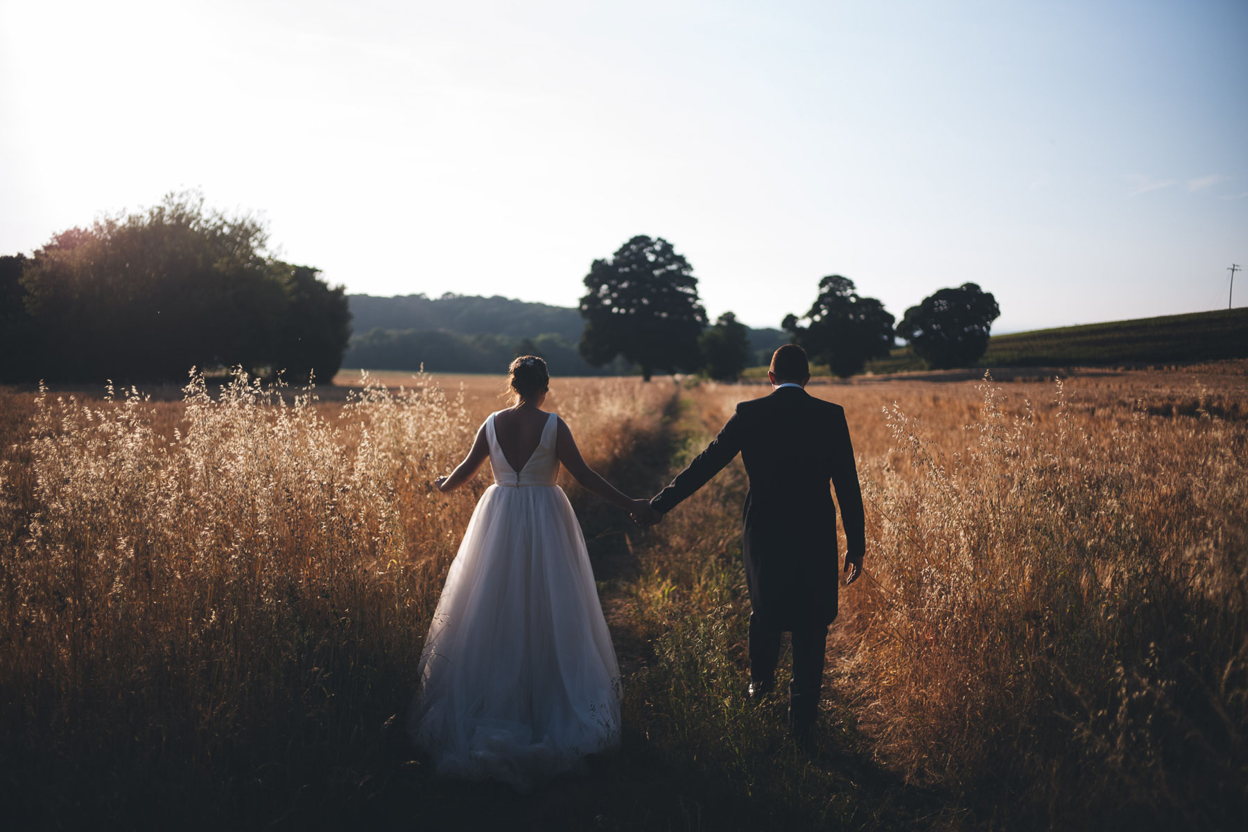 newly weds walk off into the sunset