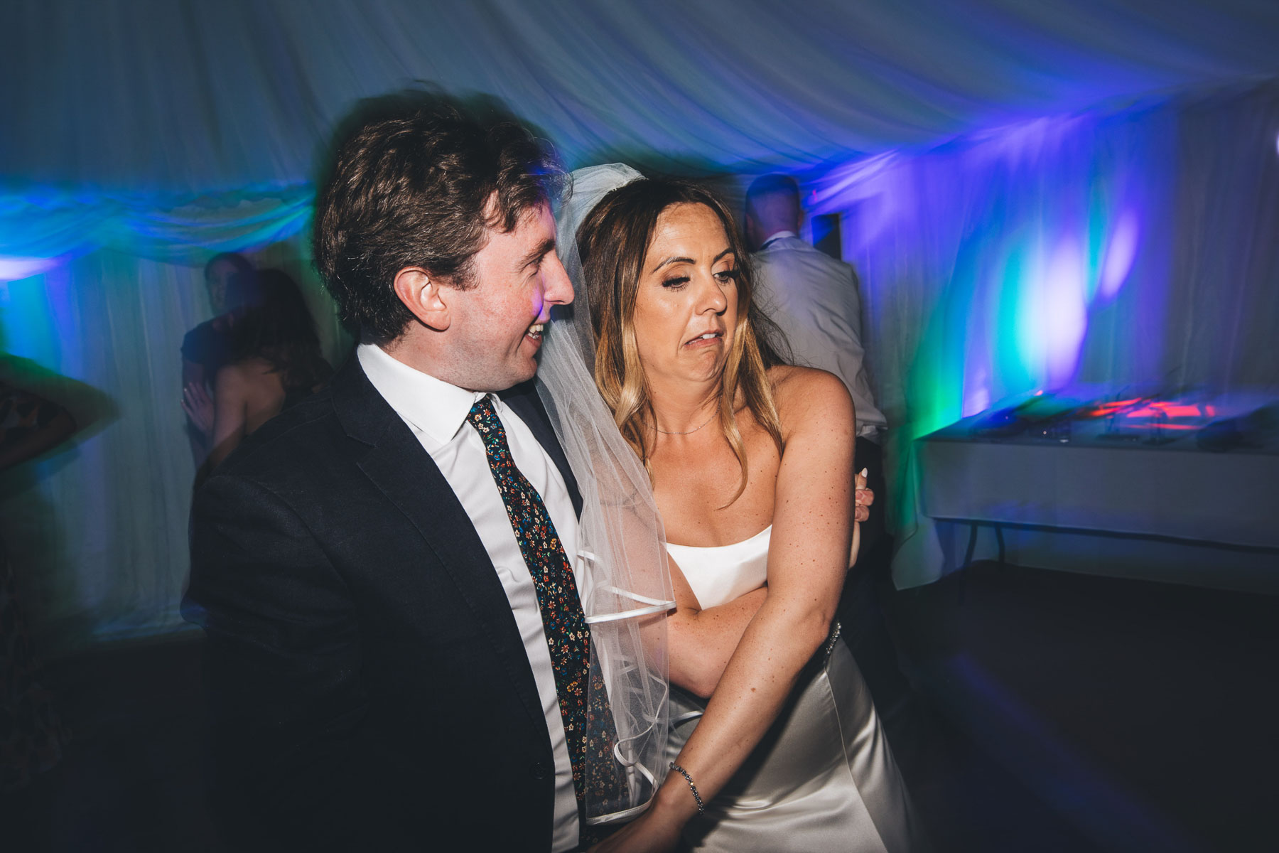 bride reaches over to guest inappropriately