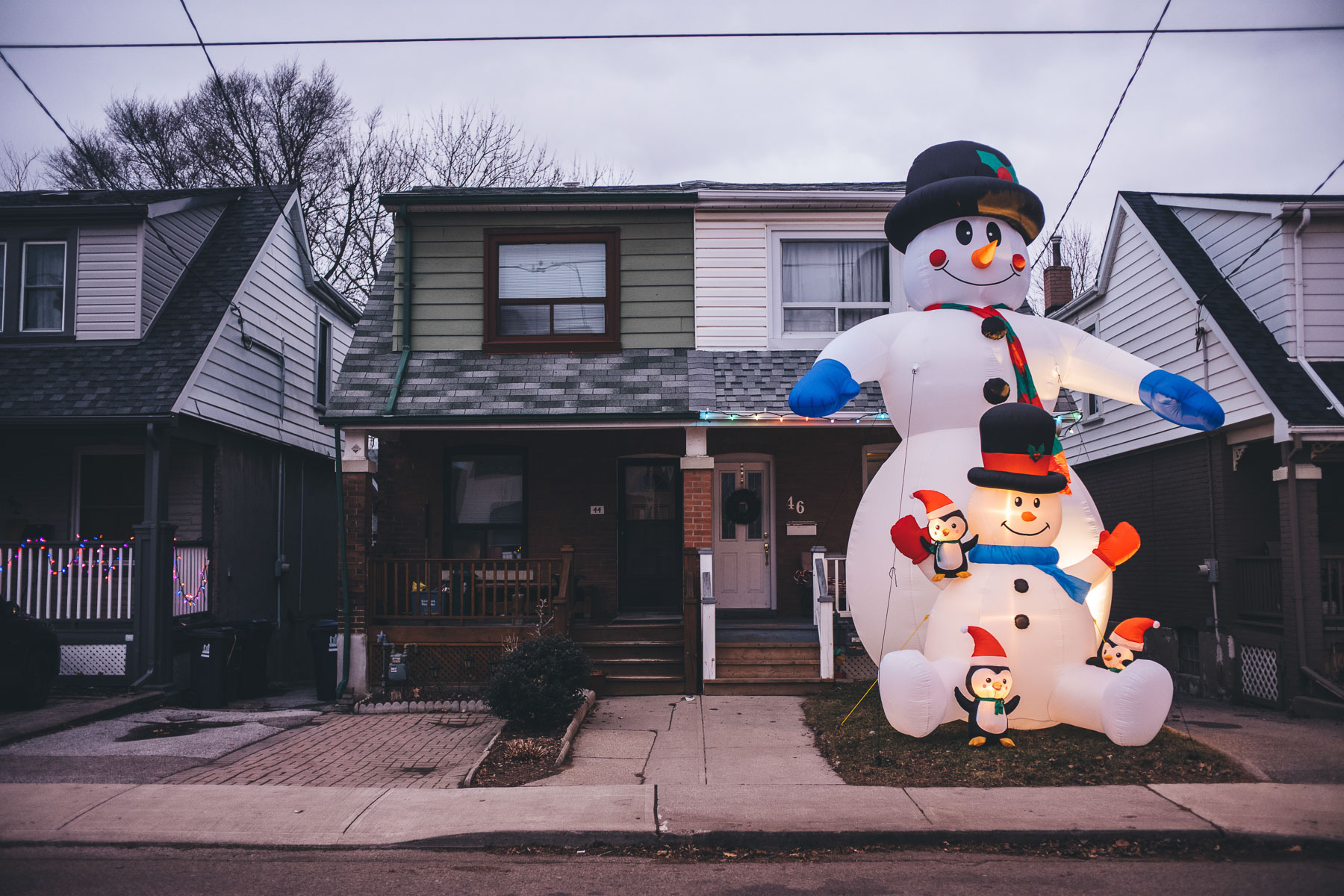 a snowman in toronto which is bigger than a house