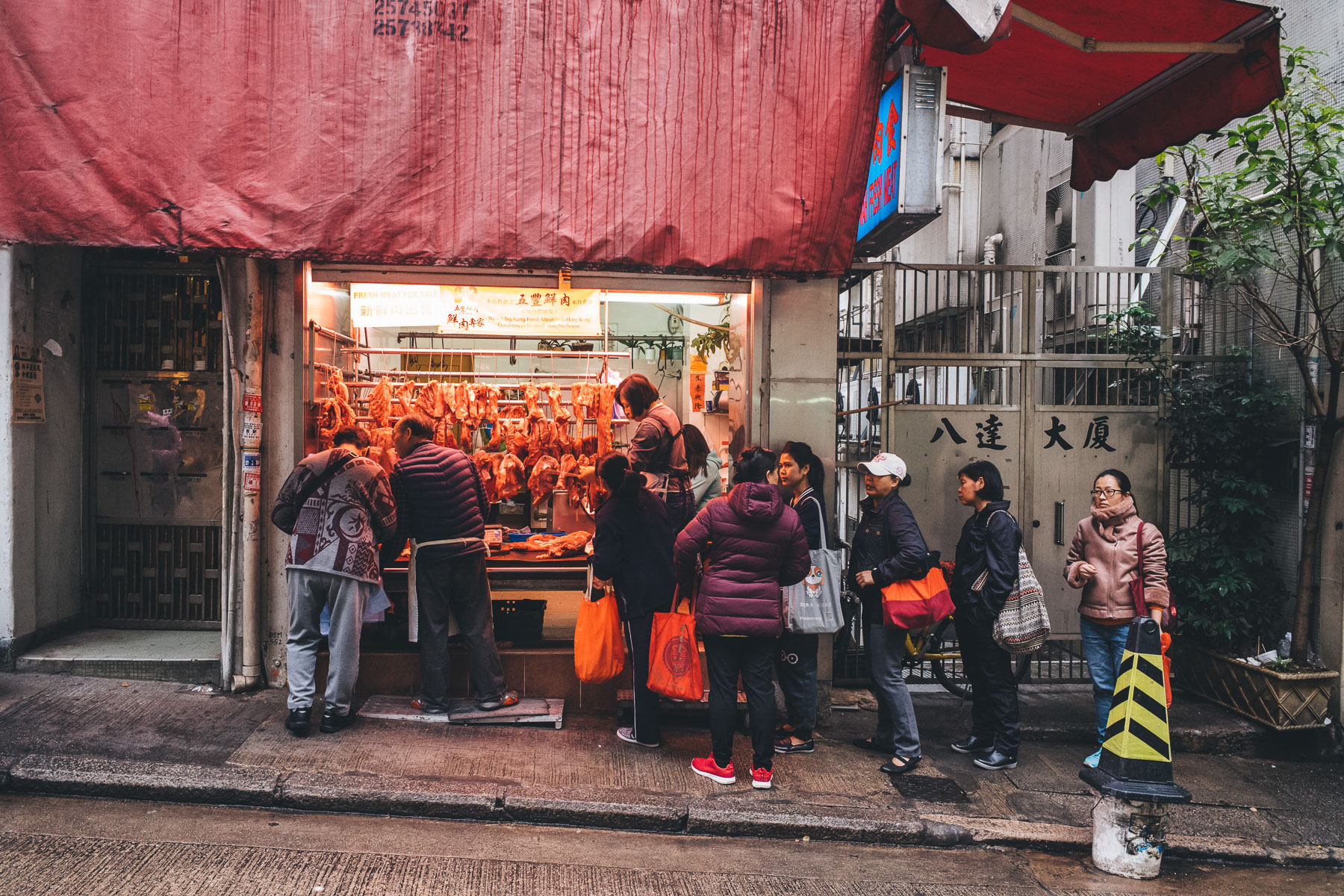 a queue at a butchers in Asia