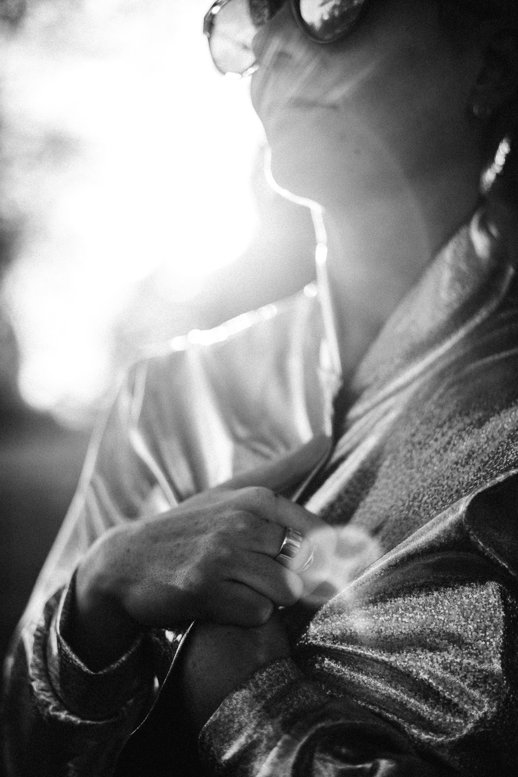 emma dressed in silver with the sun going down behind her