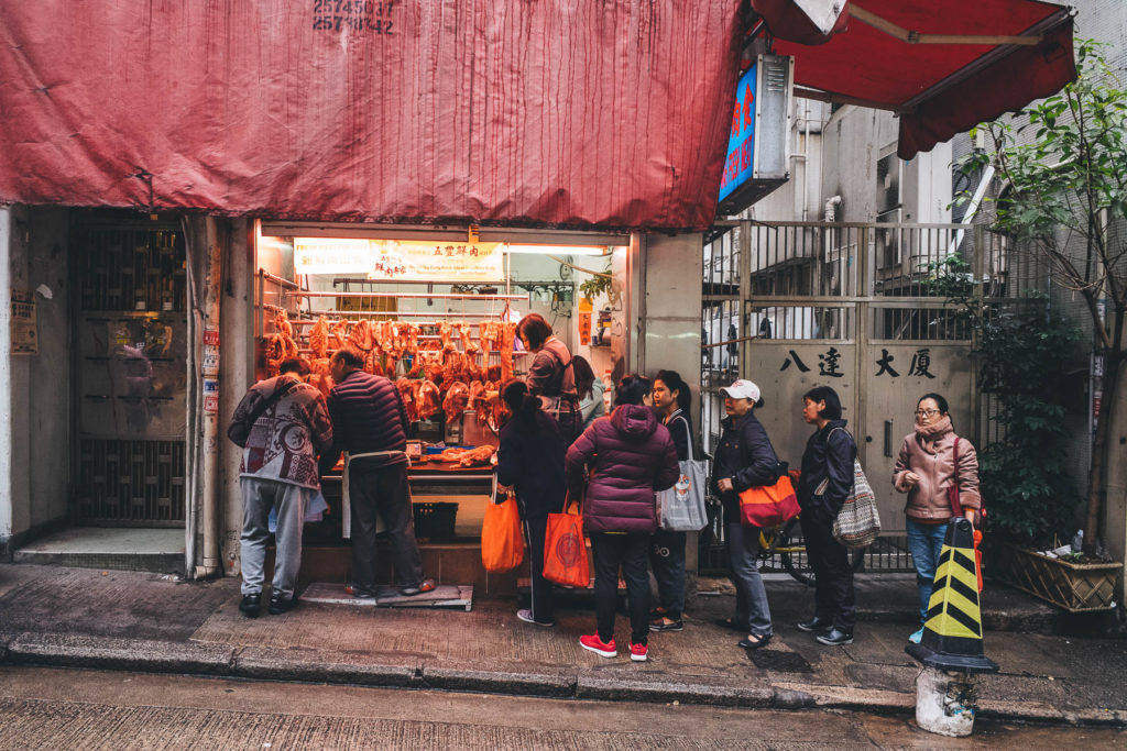 people queue at the butchers in hong kong
