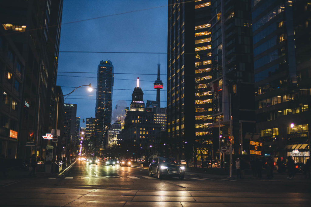 cn tower and street night photo in toronto