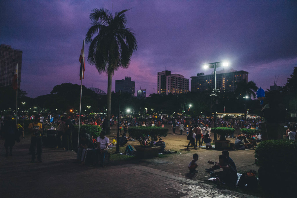manila park gathering at night