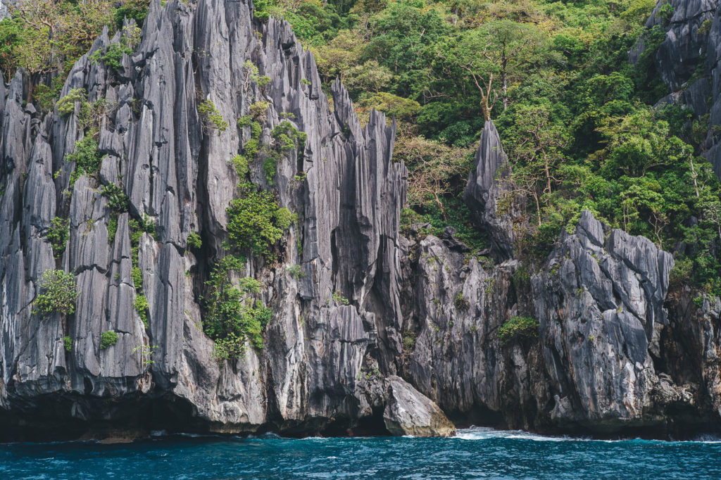 limestone formations coming out of the sea in philippines el nido
