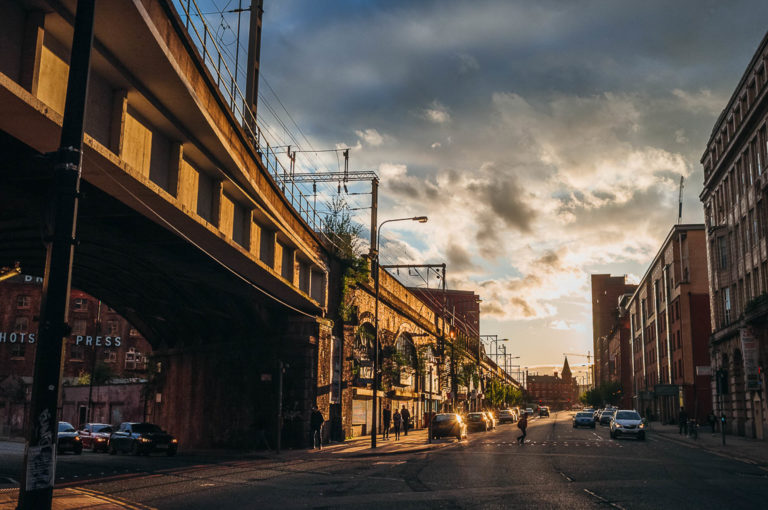 whitworth street manchester at sunset