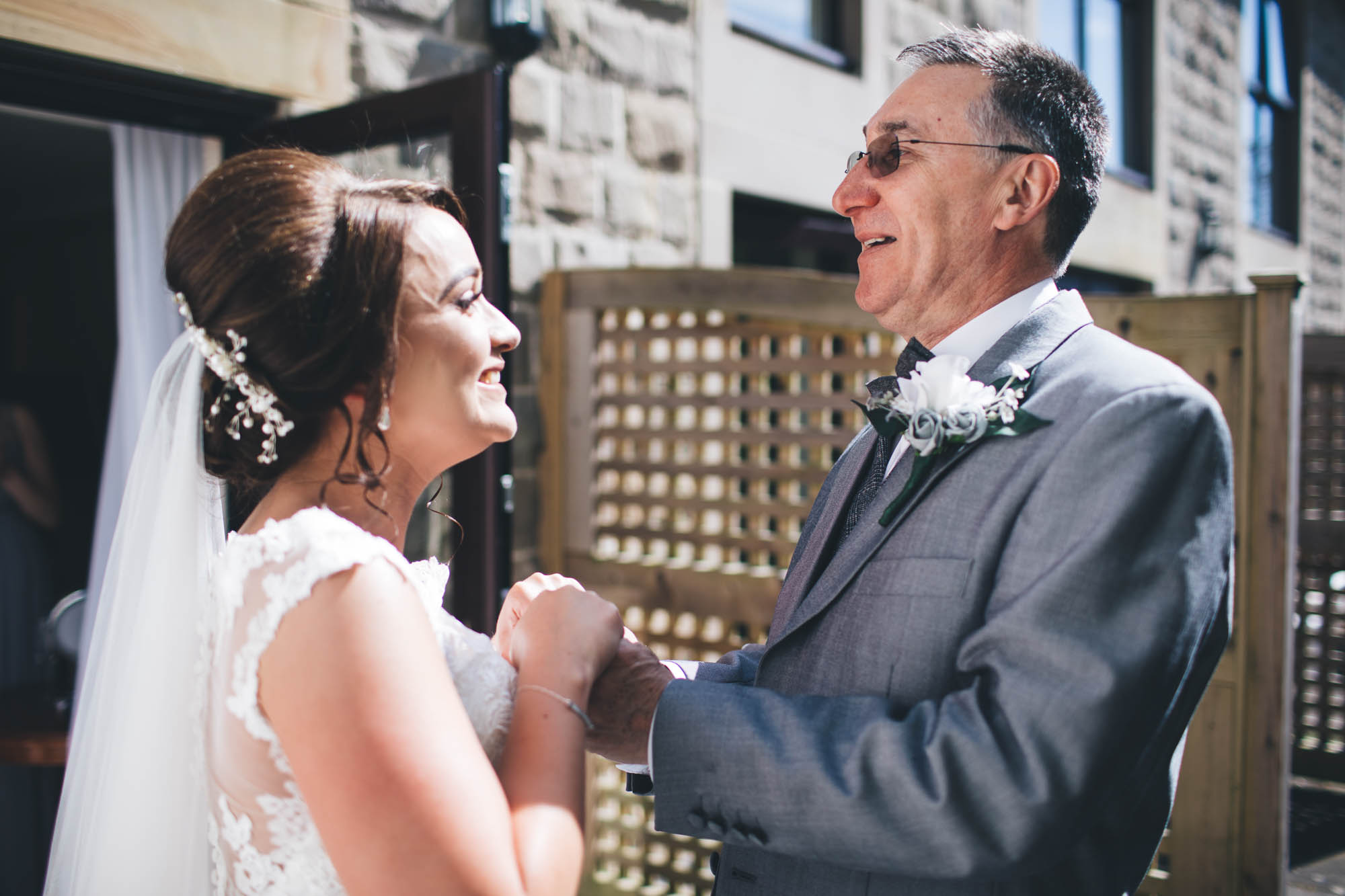 Father of Bride and daughter share a moment just after he sees her in Wedding dress for the first time