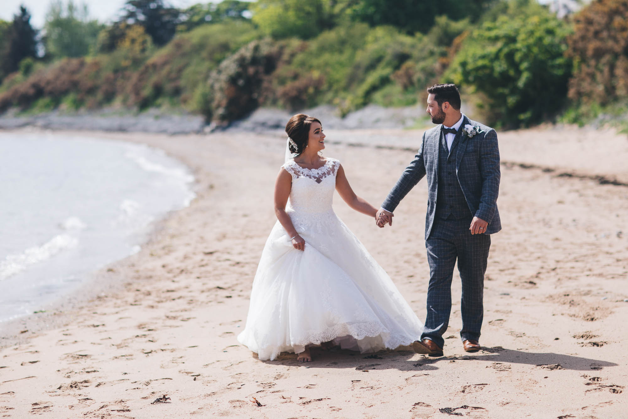 Just married couple take a stroll down the Anglesey coastline