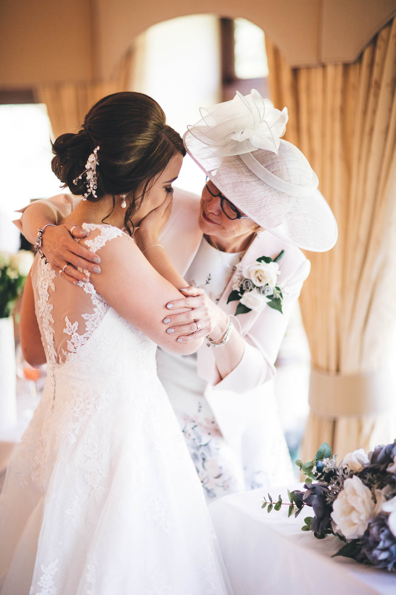 Bride and Mother of Bride share an emotional moment at the Wedding Reception