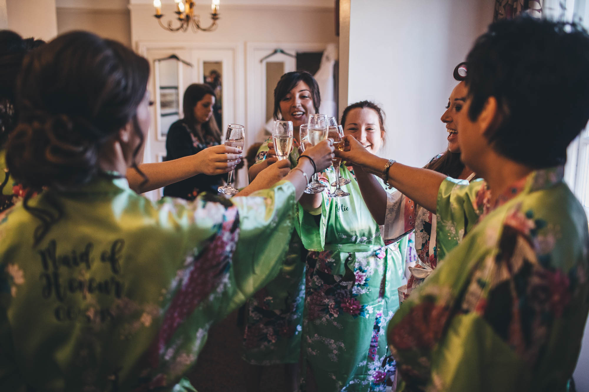 Bridal party toast during bridal preparations
