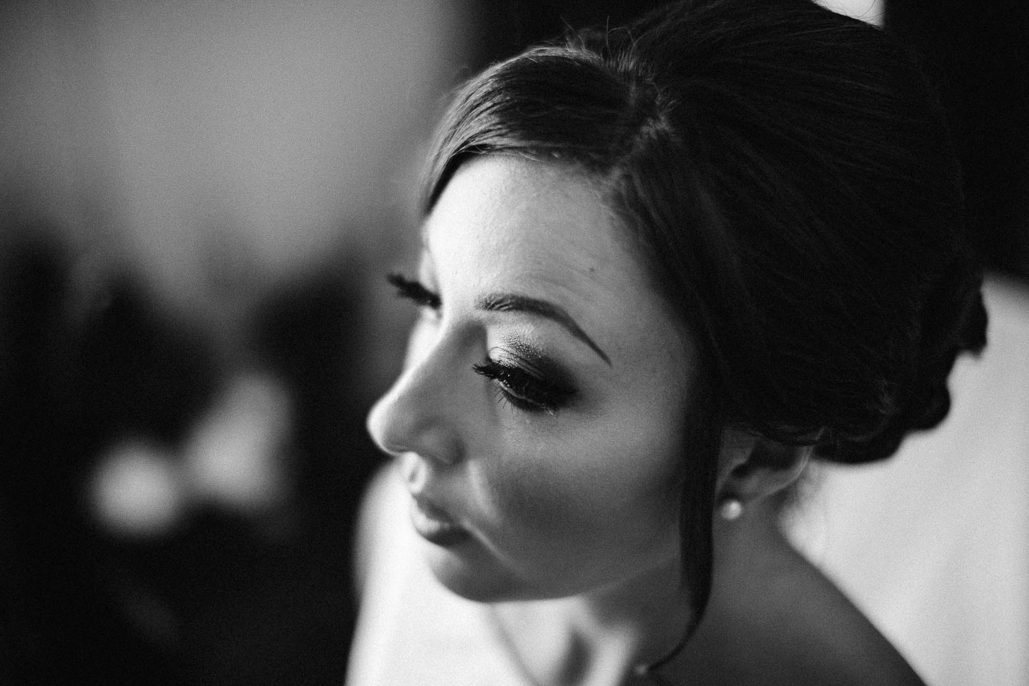 Black and white shot of Bride's make up pre-wedding