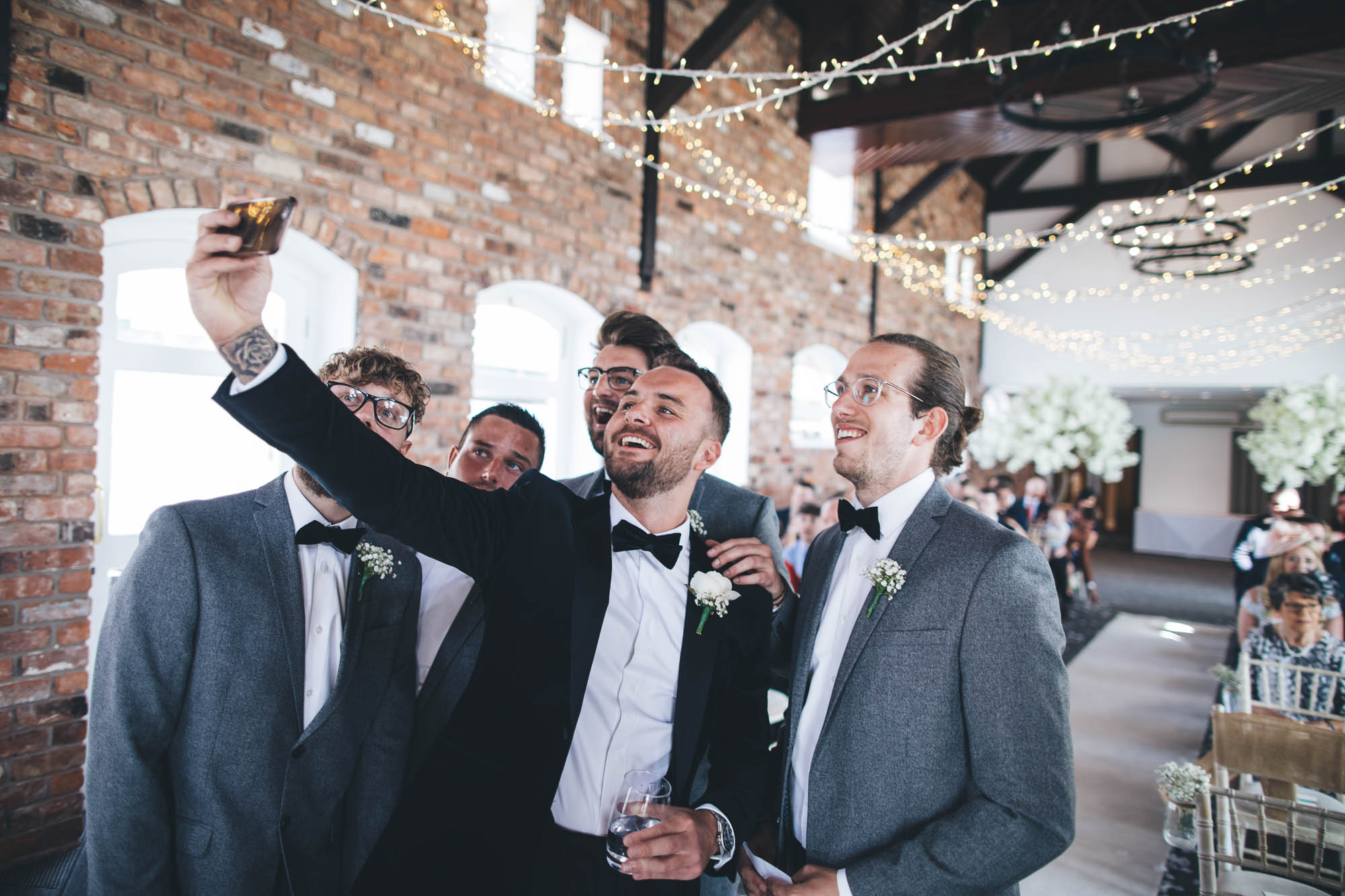 Groom taking a selfie with Best Man and Ushers just before the wedding ceremony