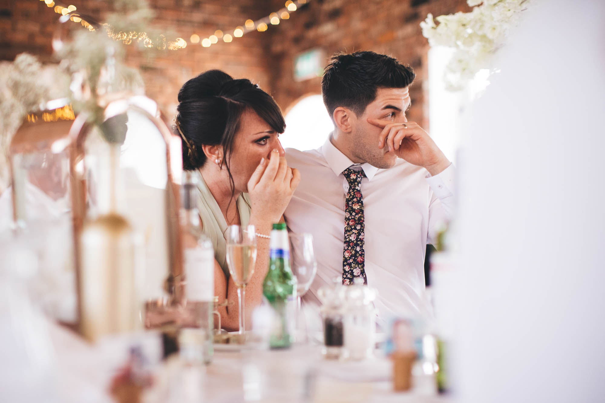 Wedding guests crying at emotional wedding speech