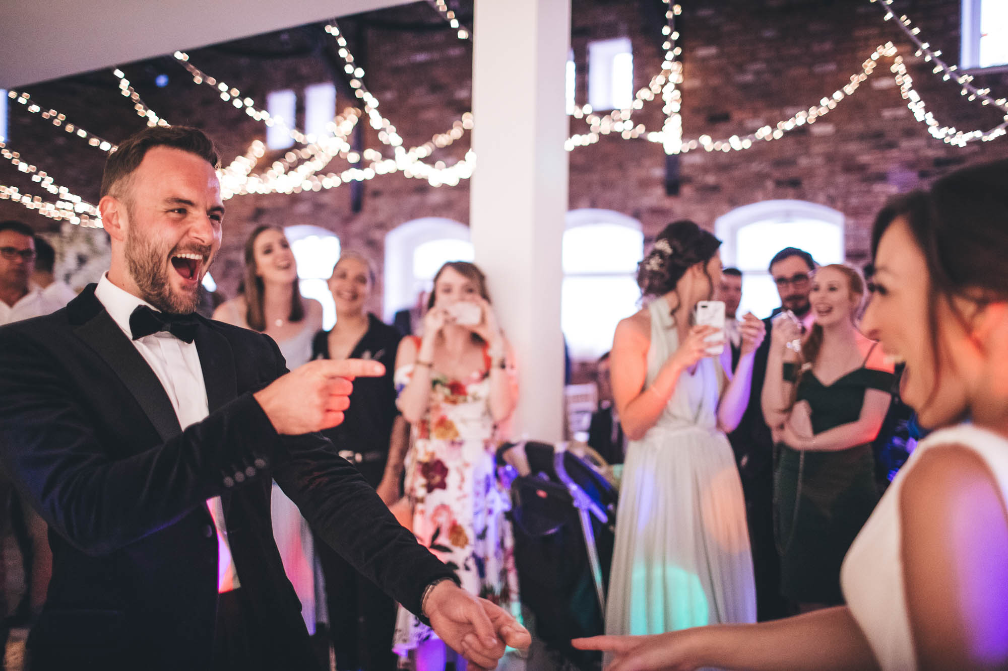 Bride and Groom have fun with each other on the dancefloor