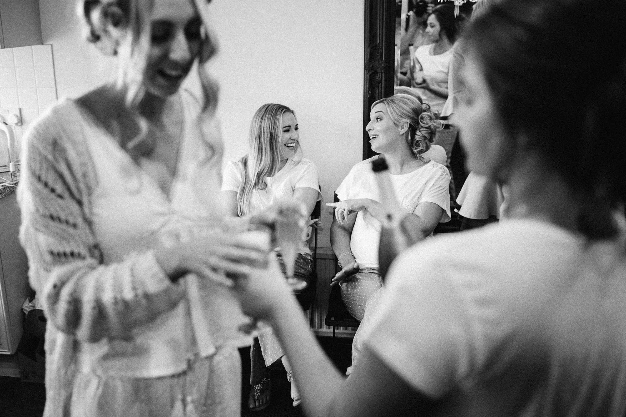 Black and white shot of bridal party preparations