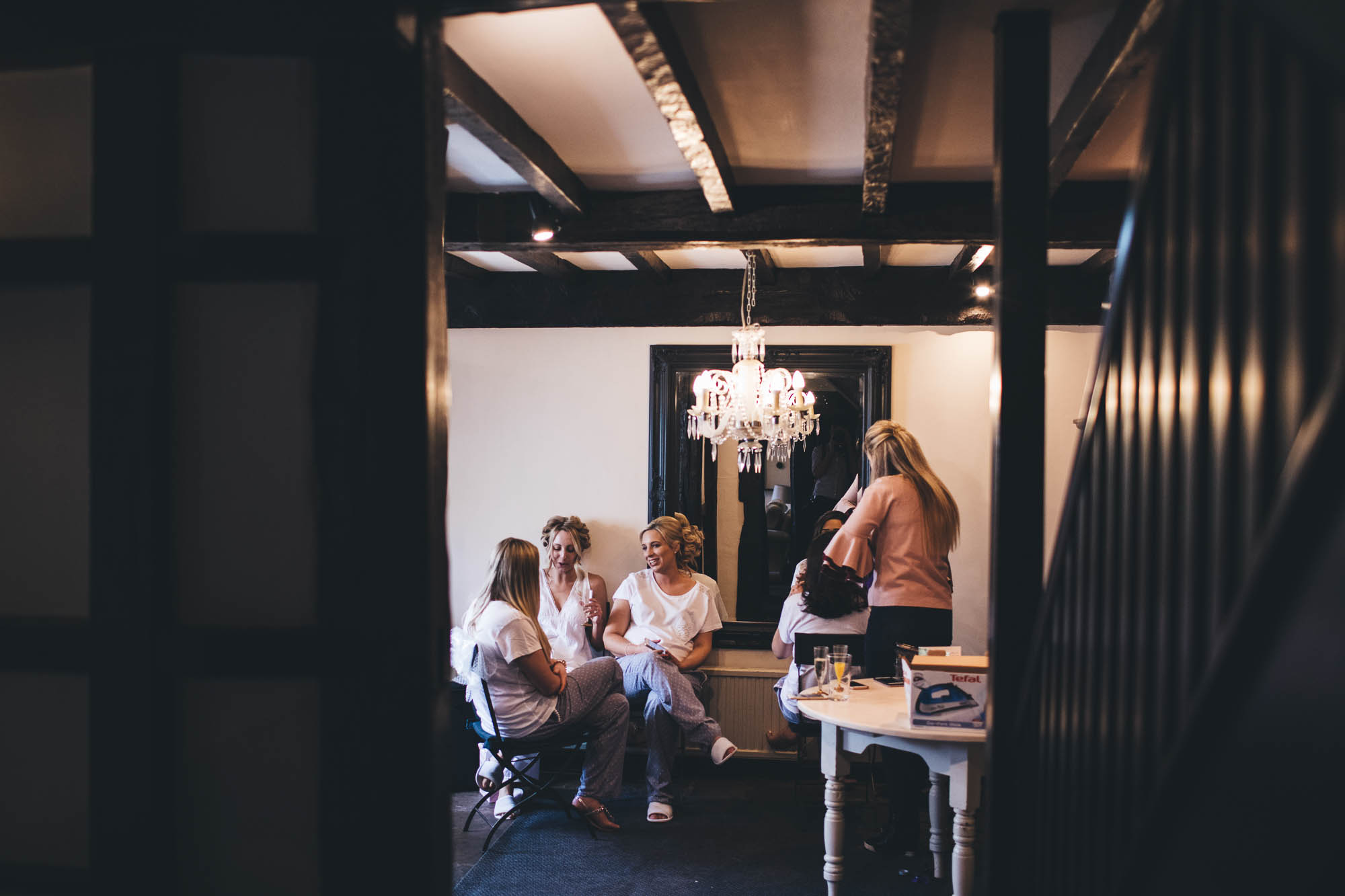 Peering into room as Bridal party relax on the morning of wedding