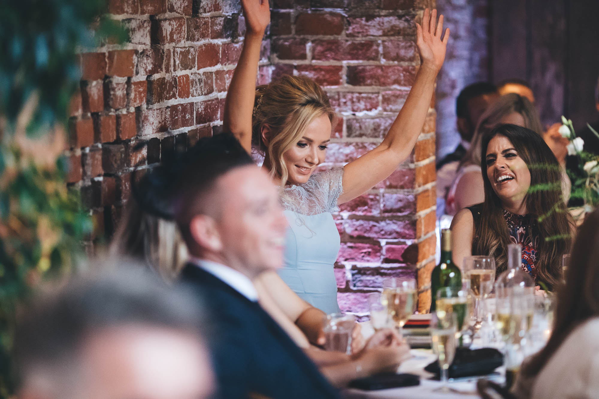 Bridesmaid gets into the party spirit at wedding reception