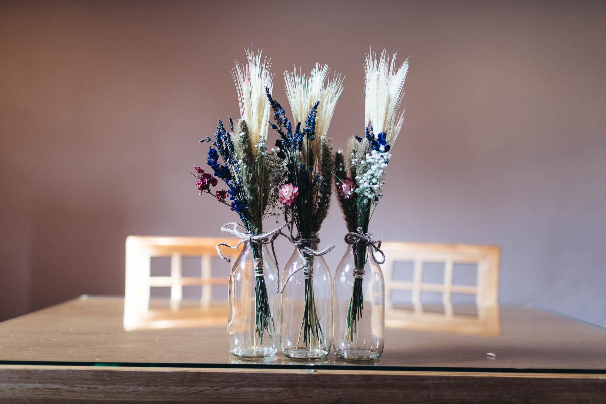 Dried rustic flower arrangements on table