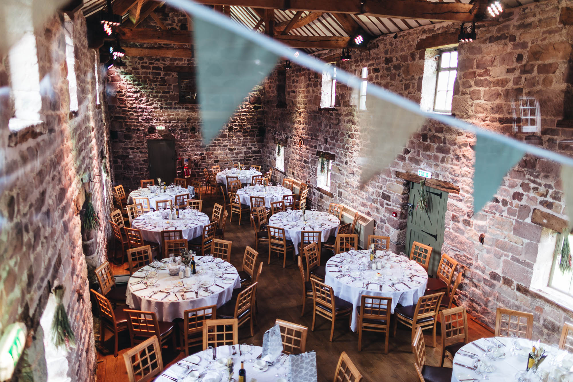 Wedding Breakfast set up in rustic barn at The Ashes Wedding Venue, Staffordshire