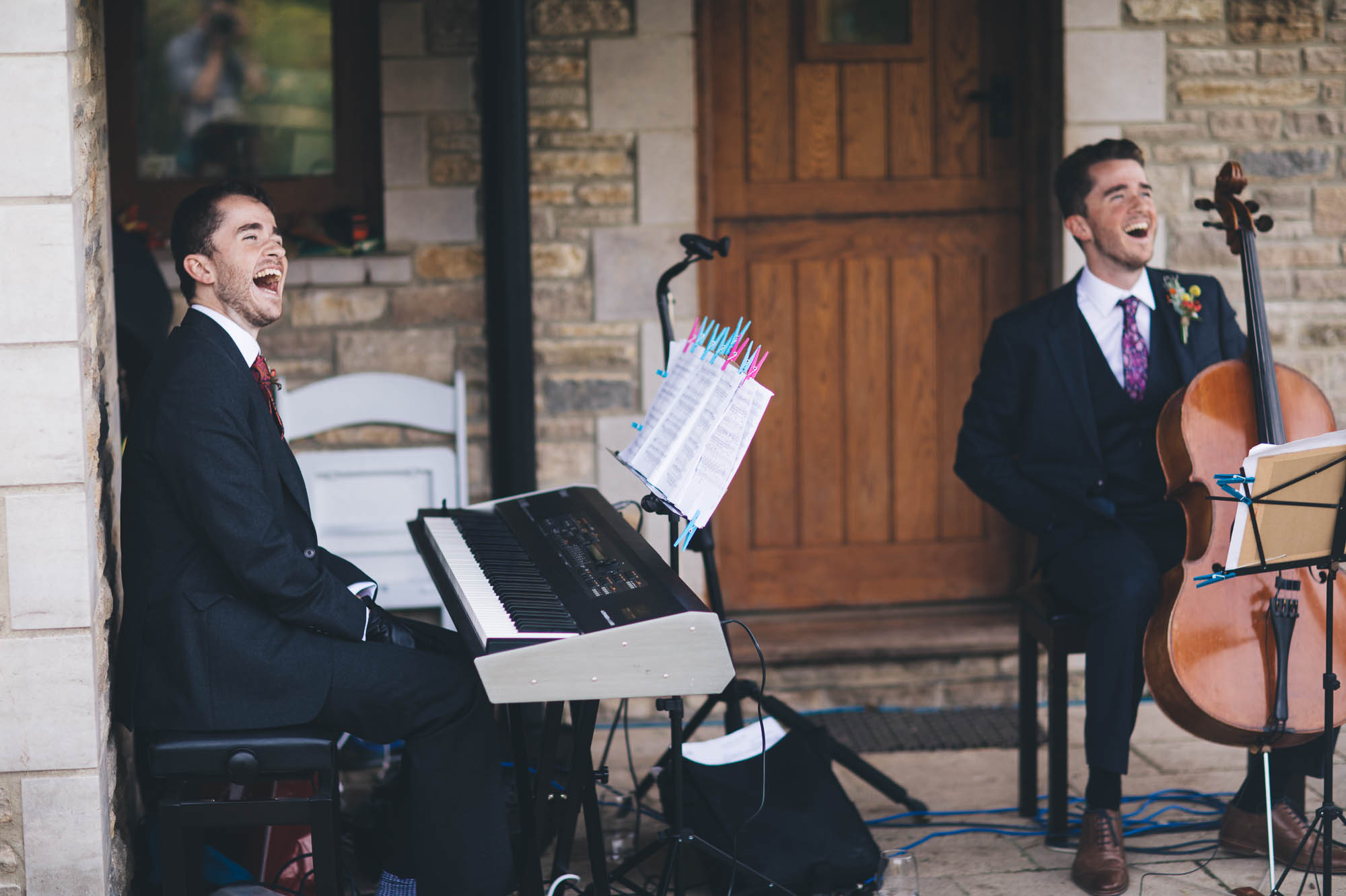 twin brothers play music during the wedding