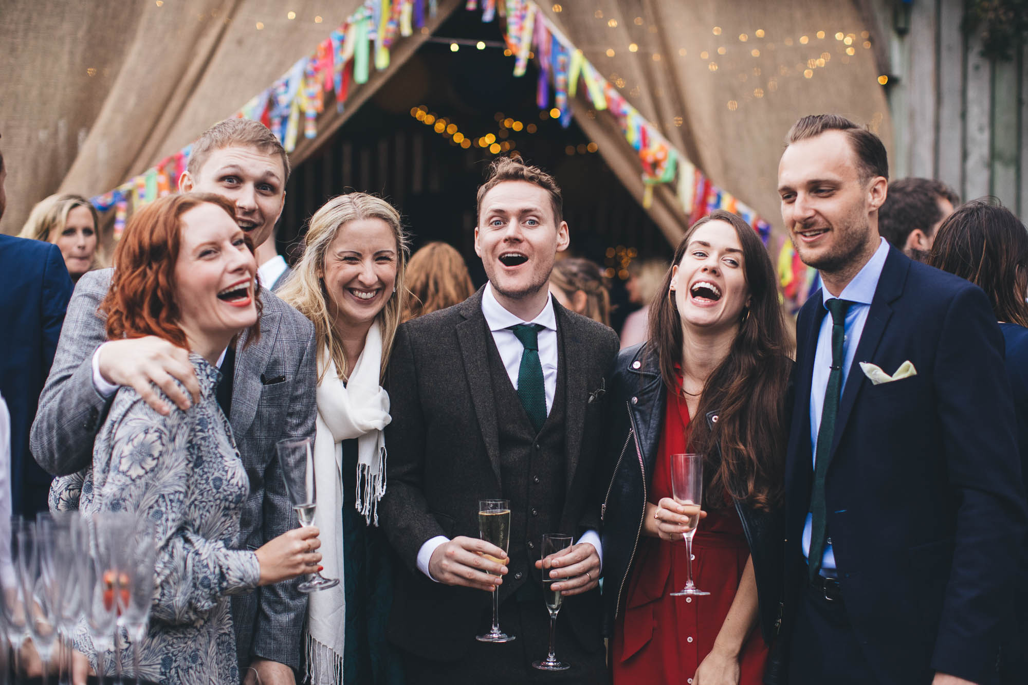 wedding guests laugh together