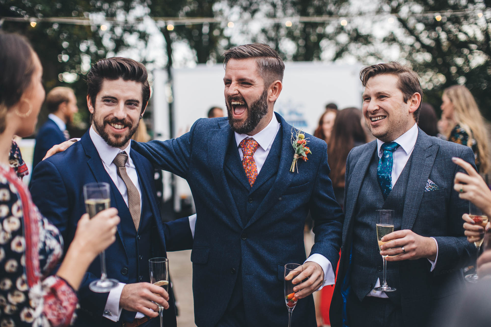 groom laughs with his mates
