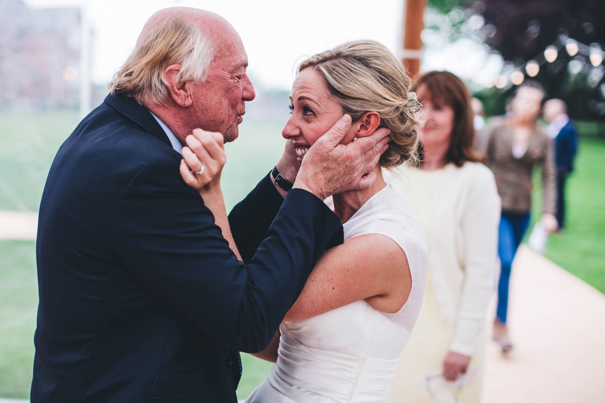 grandad in a really sweet and emotional embrace with the bride