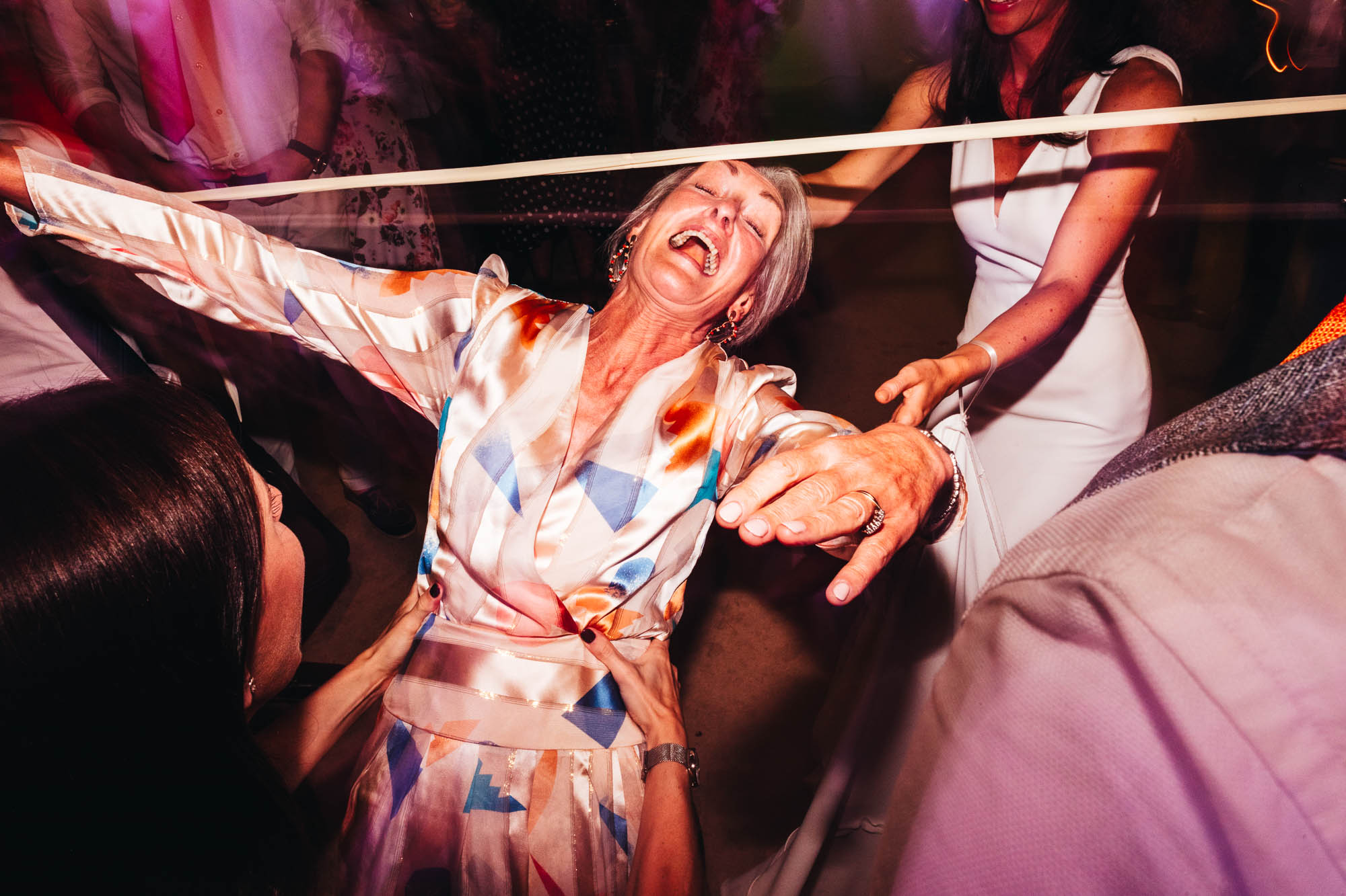 mother of the bride doing the limbo dance