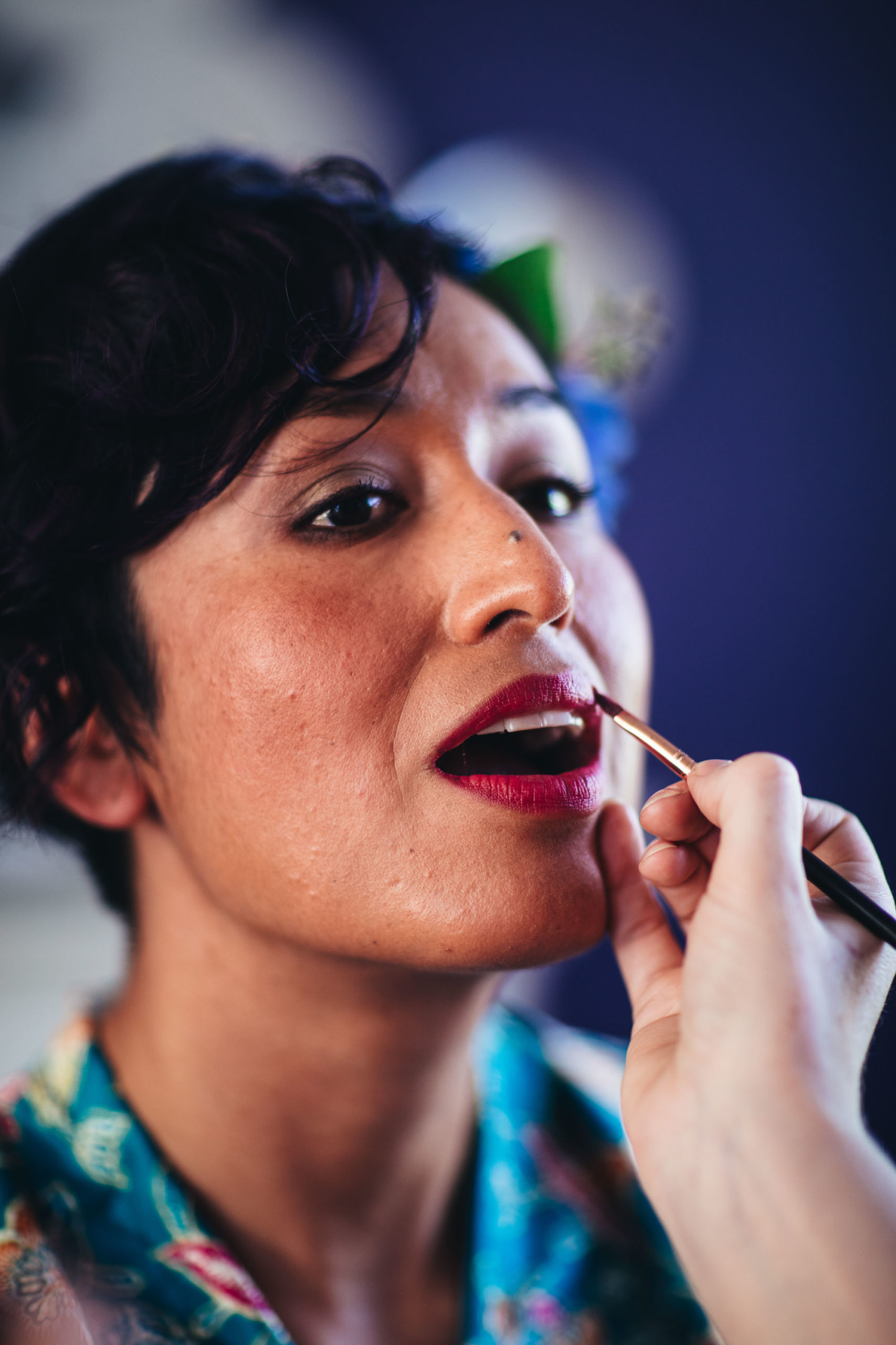 bride has lipstick applied