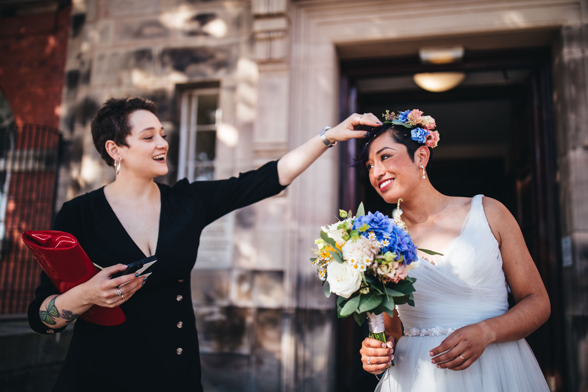 guest removes confetti from brides hair