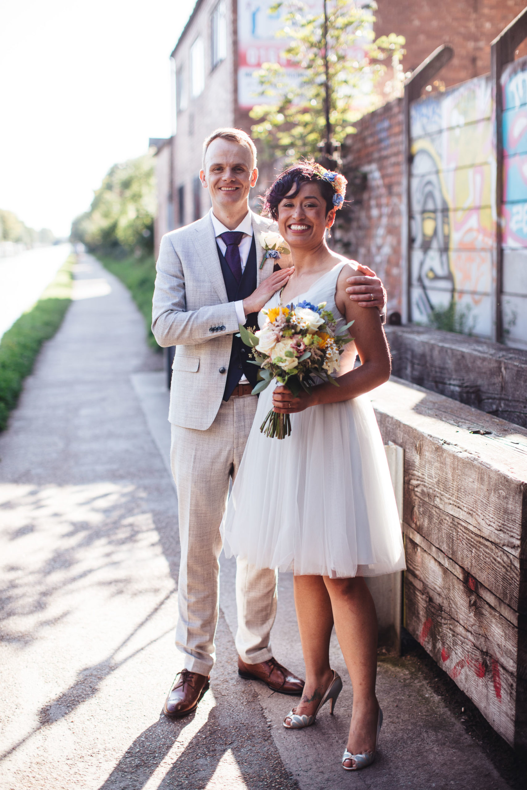 couple pose in backlit sunshine