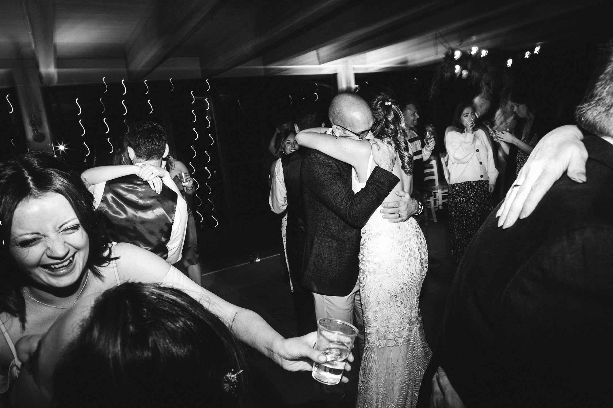 wife and husband hug on the dancefloor