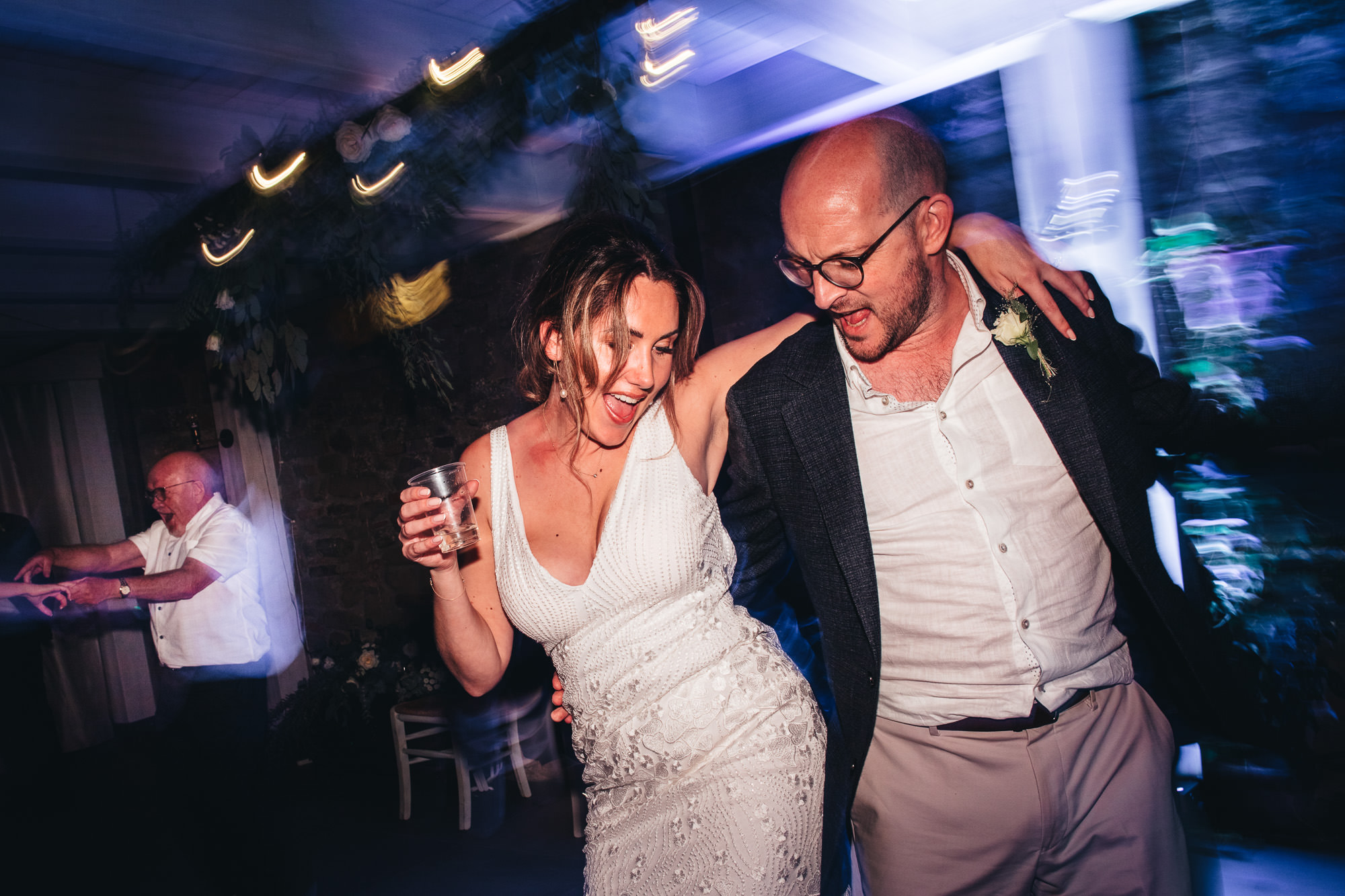 bride and groom hip to hip on the dancefloor