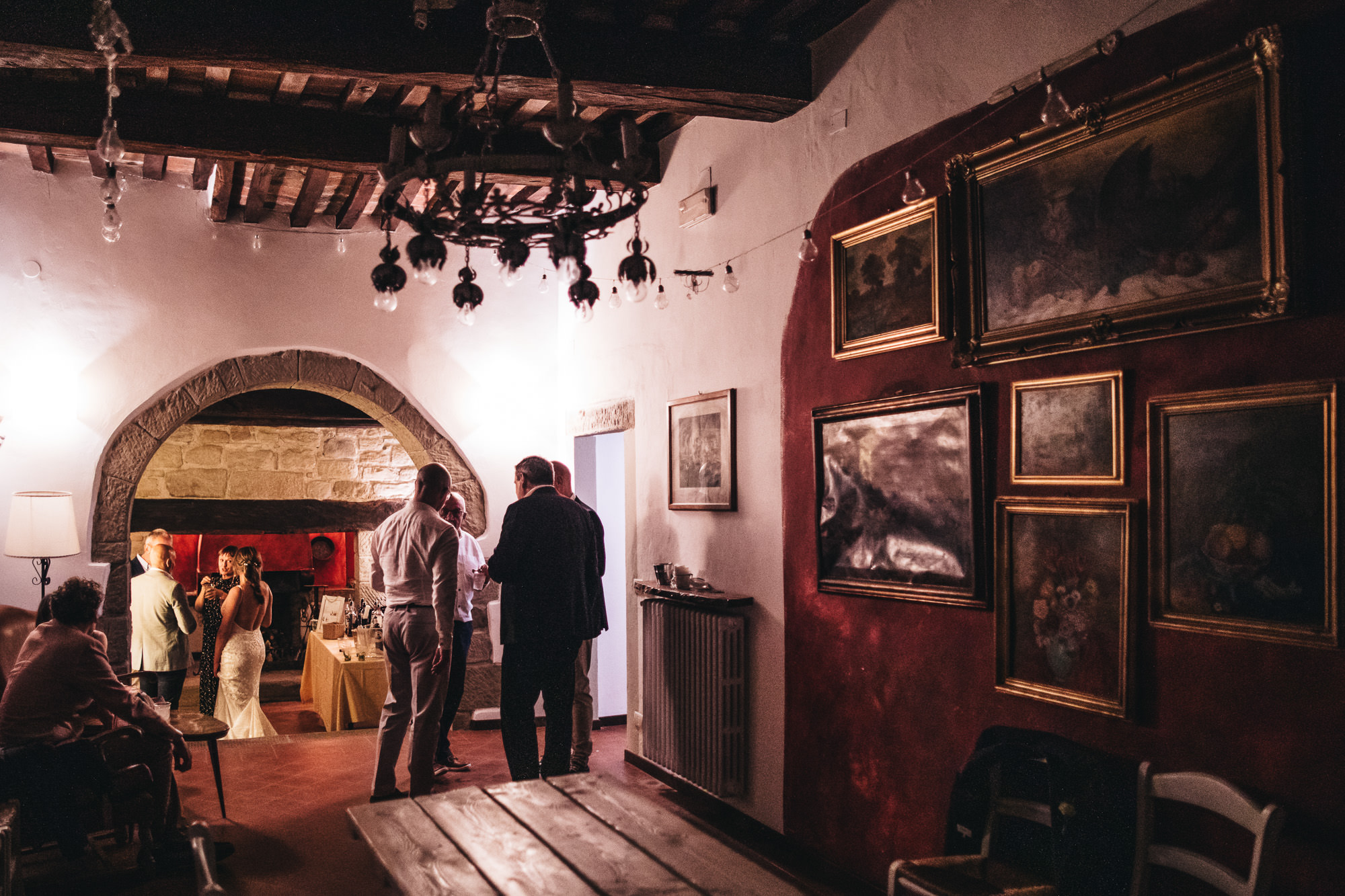 wide shot of dining room and pictures hung on the walls