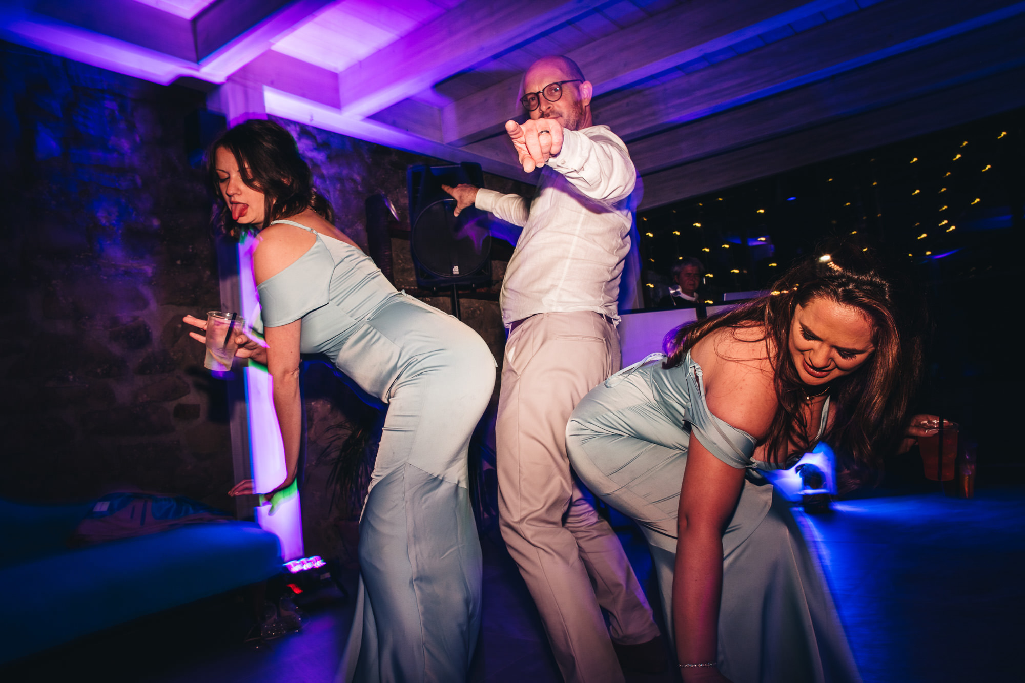 funny dancing groom and bridesmaids