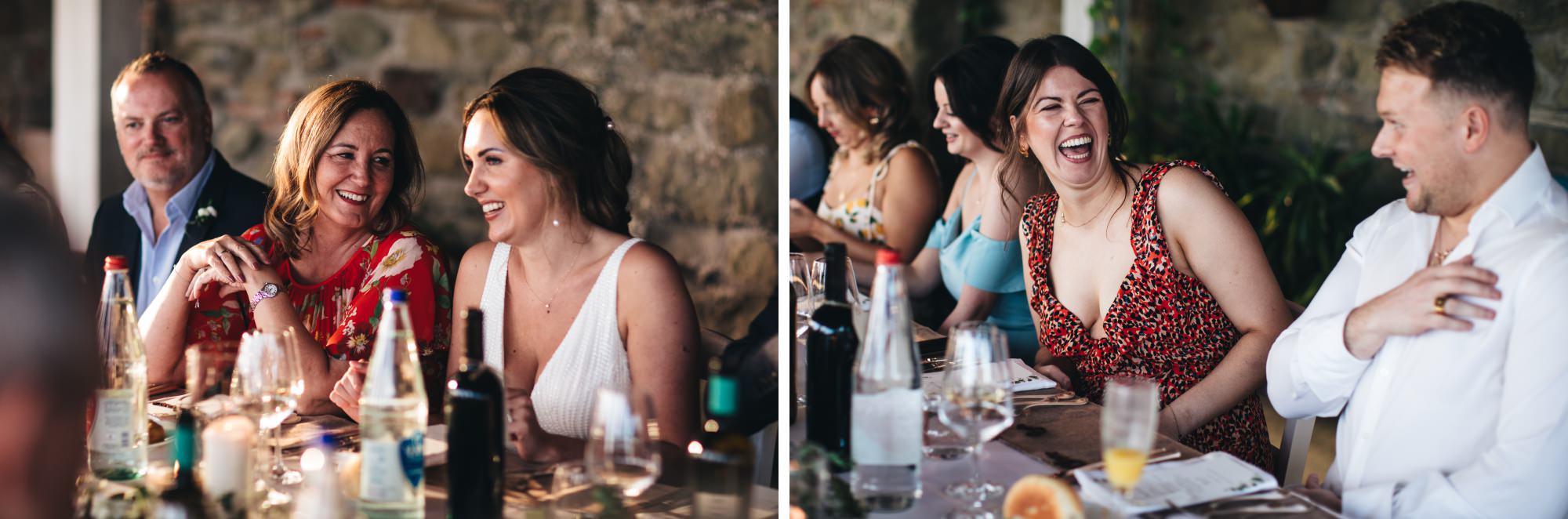 weeding guests laughing at dinner