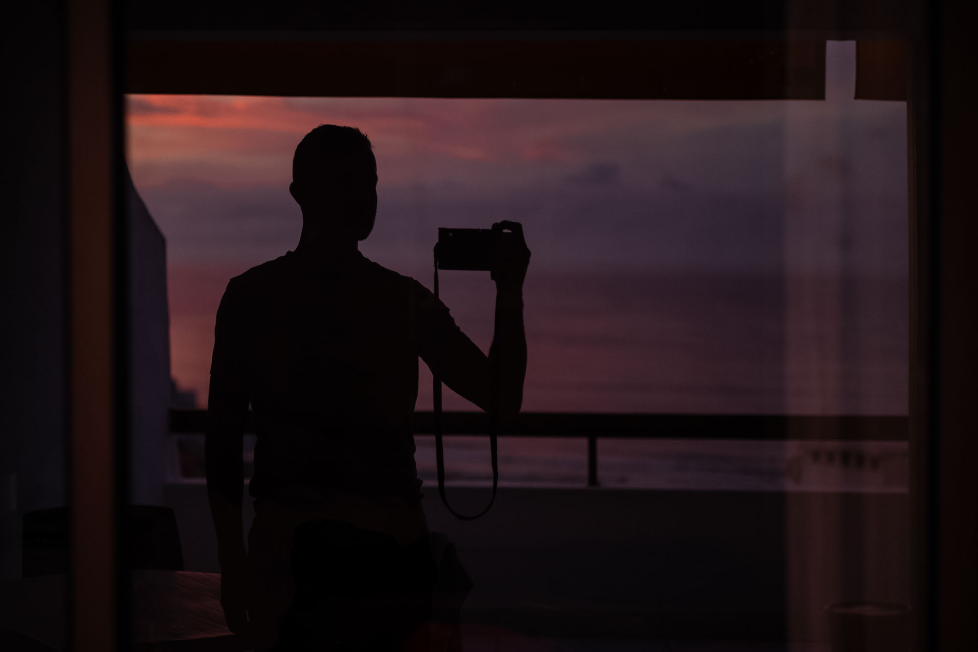silhouette self portrait with sunset red sky