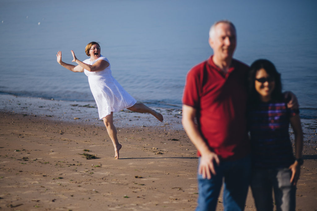 brides on tip toe photo bombing