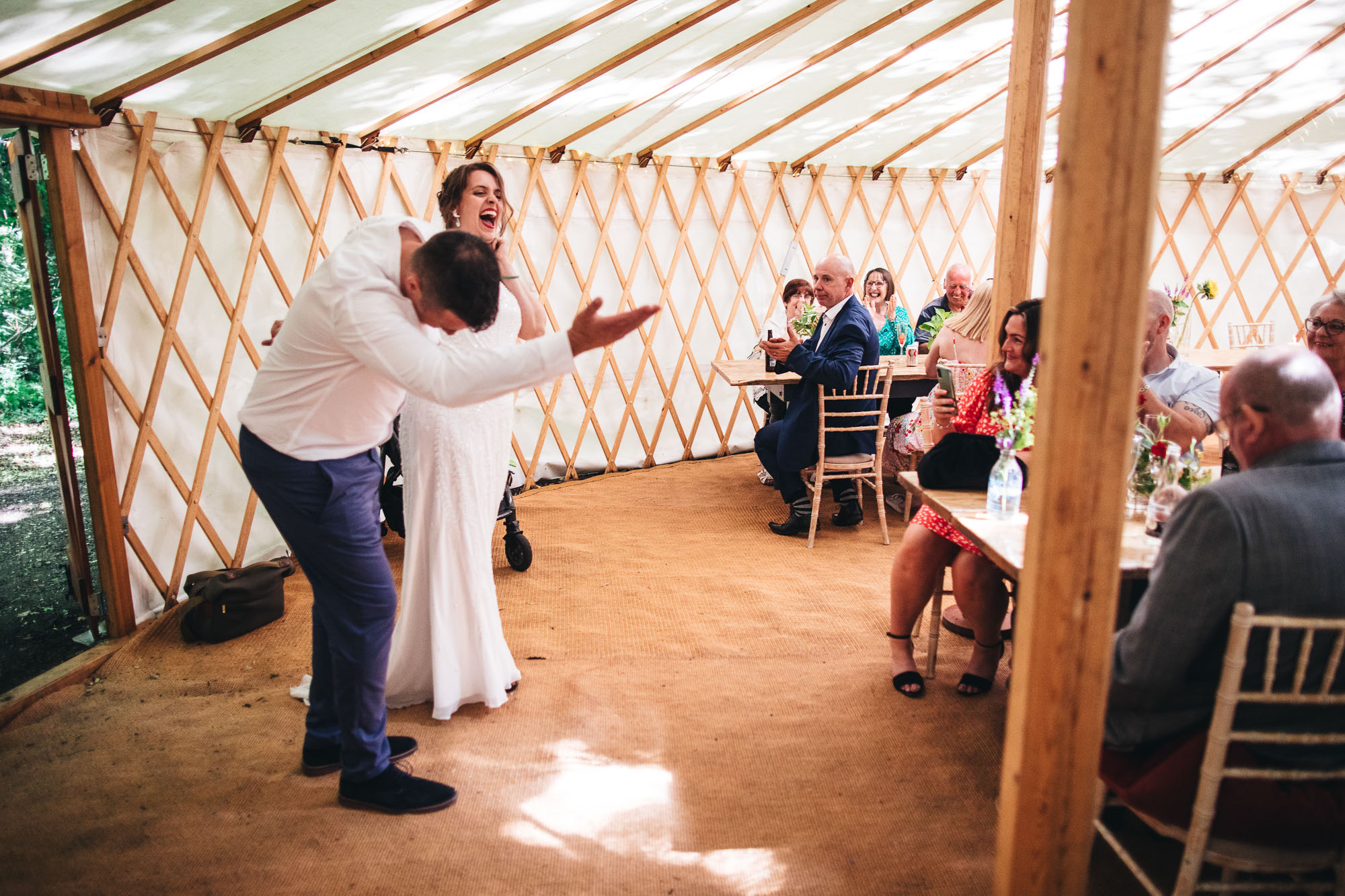 couple gestures arrival into yurt