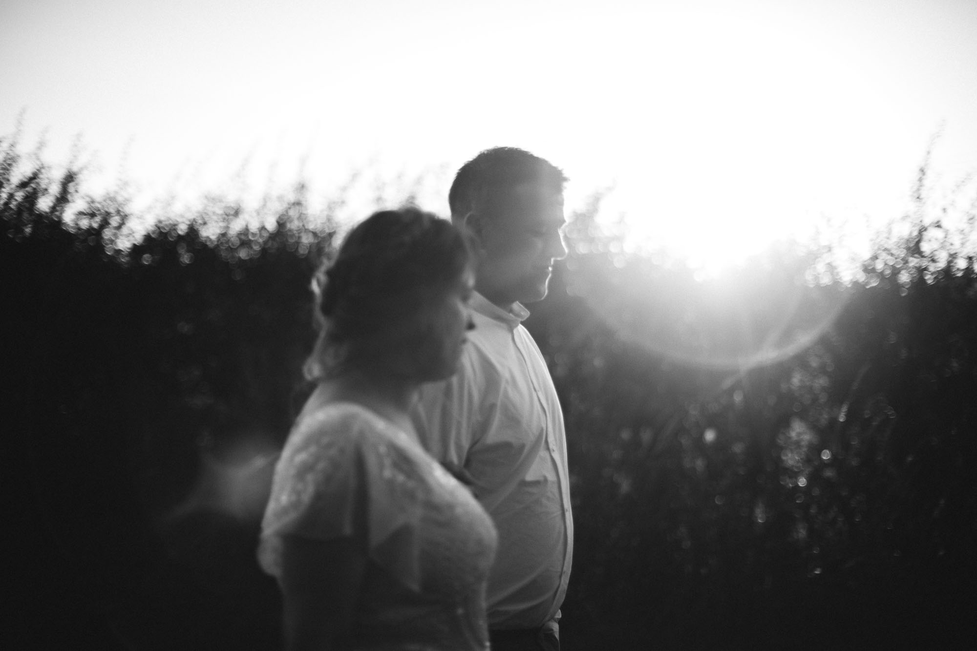 whimsical romantic shot of couple in sunlight and black and white style photography