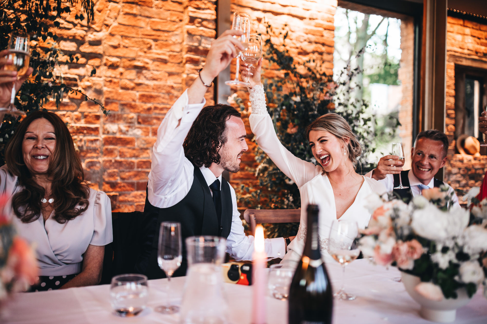 couple raise their glasses to cheers