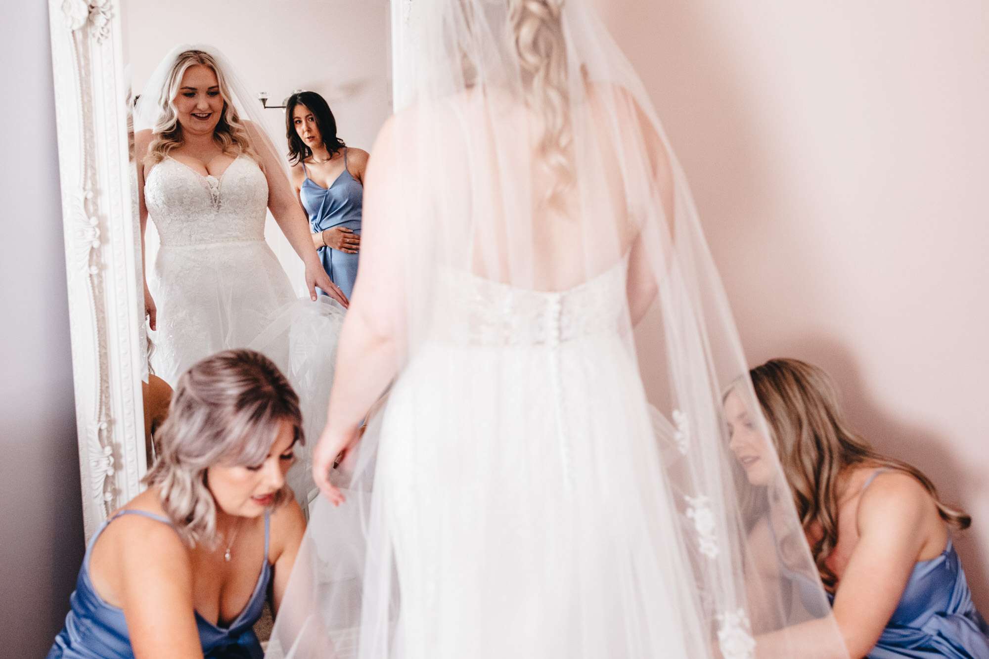 bride is getting ready with maids