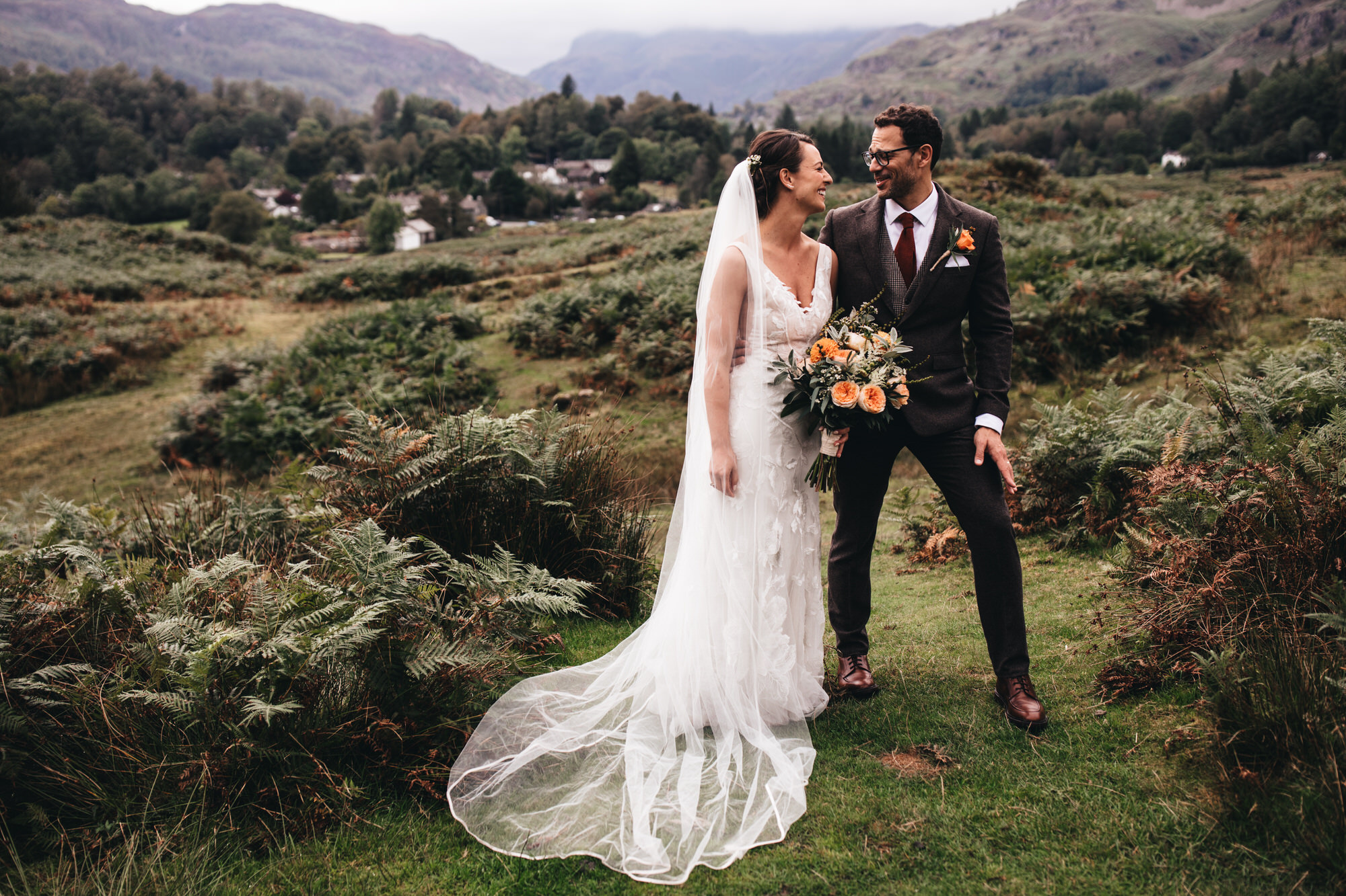 couple in lake district setting beautiful hilly landscape