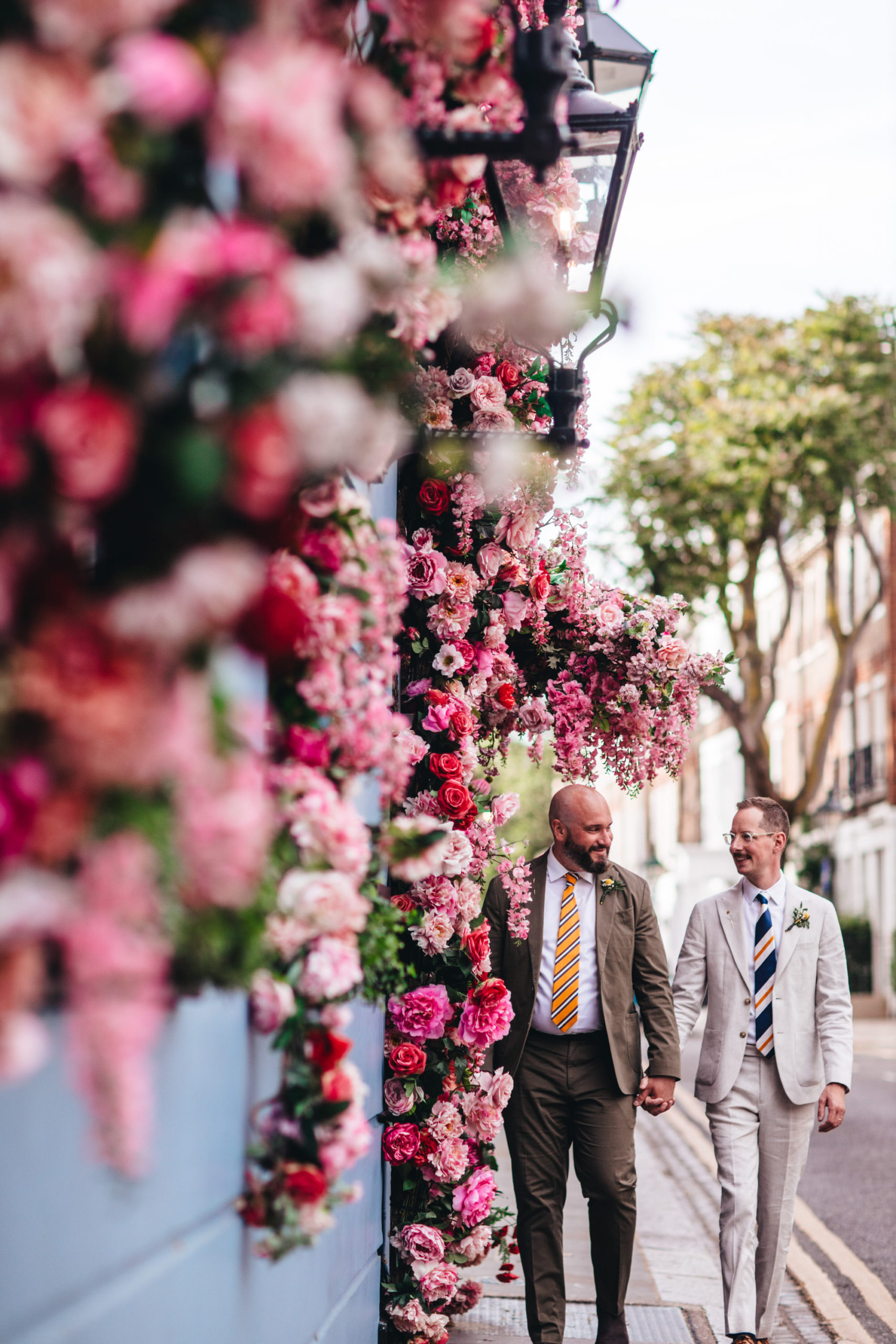 gay couple walk in Chelsea flower show