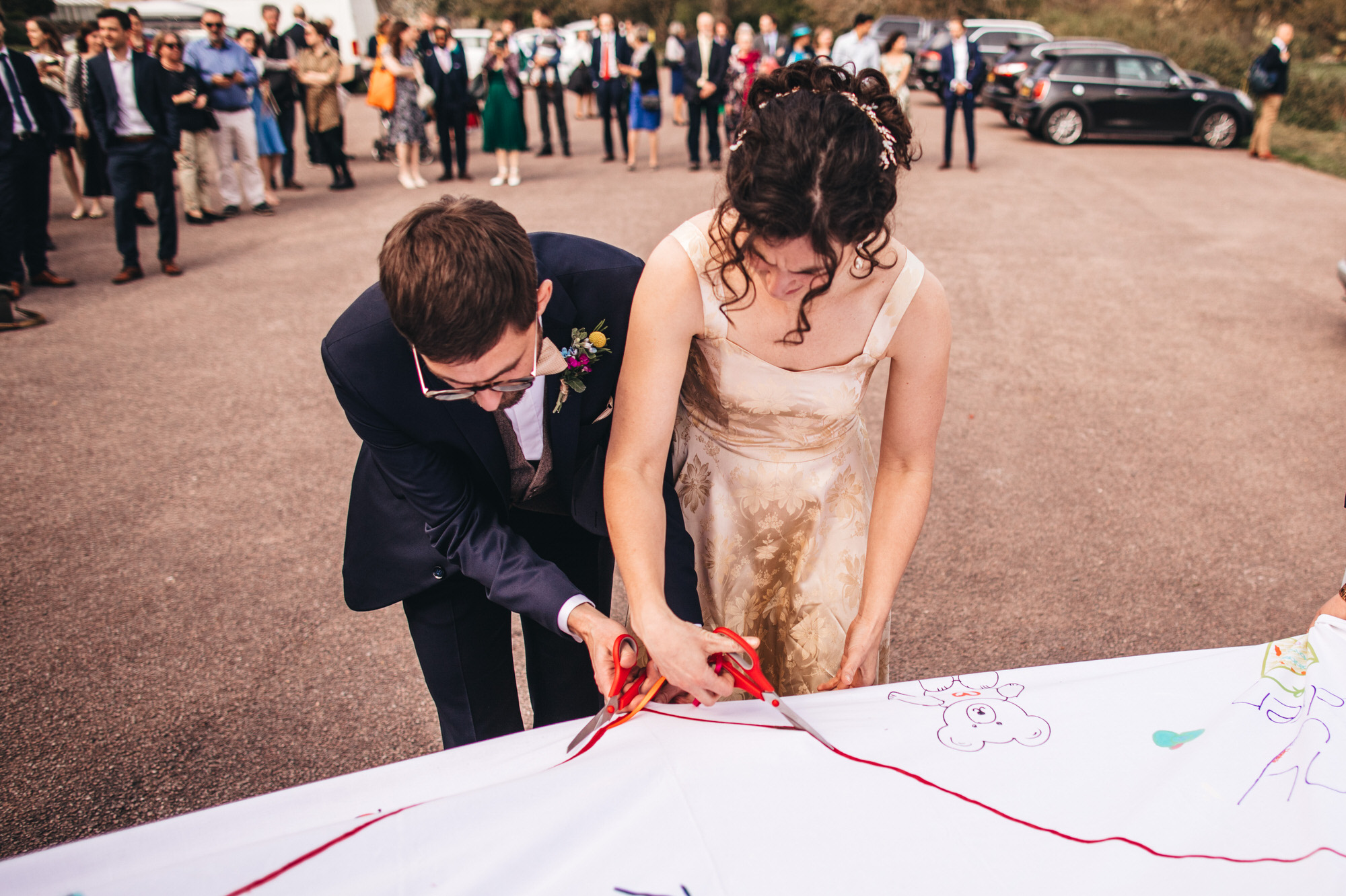 couple cut ribbon