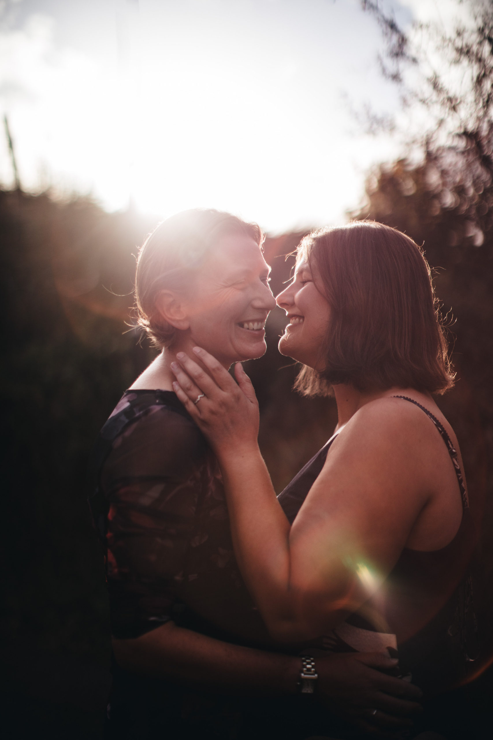 two women get married and have kiss in sunshine